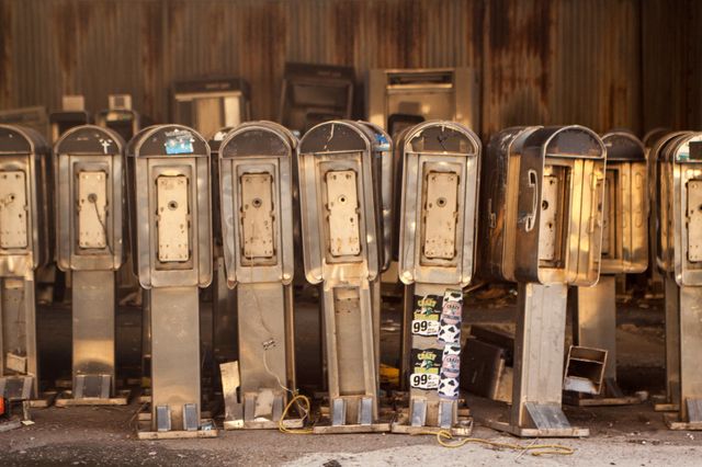 Broken pay phones lined up underneath the West Side Highway at 135th and 12th Ave